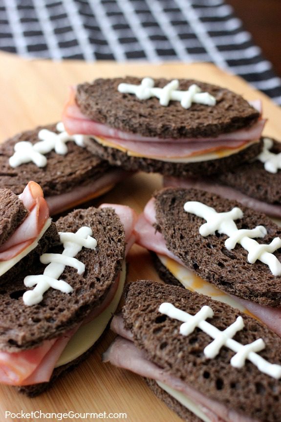 Serve these Football Shaped Sandwiches at your next party or while watching the Big Game! Pin to your Recipe Board!