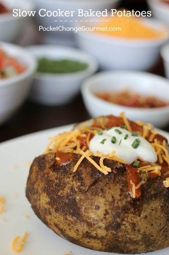 Slow Cooker Baked Potatoes - a simple and easy side dish, or add your favorite toppings and serve a Baked Potato Bar! Pin to your Recipe Board!