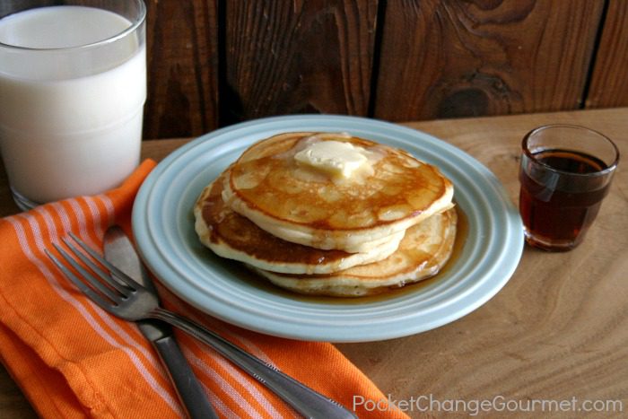 A plate of Old Fashioned Homemade Pancakes with syrup and milk