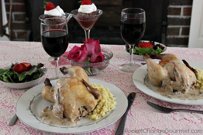 A romantic meal good for 2 with wine and Cornish Hens on the table