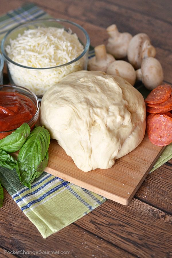 Why buy store bought pizza dough or frozen pizza when you can make this EASY Bread Machine Pizza Dough at home! With just 5 ingredients you probably already have in your kitchen, you can have fresh, homemade pizza! 