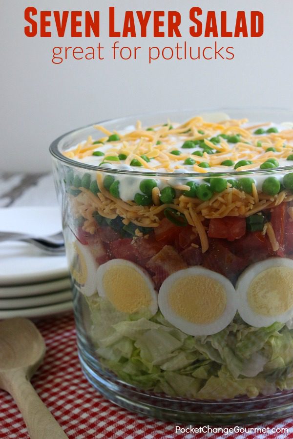 Heading to a potluck? Hosting a cookout? This Classic Seven Layer Salad Recipe is a MUST make! A crowd-pleaser for sure! It's super easy to make, can be made ahead and feeds a crowd! - seven layer salad recipe