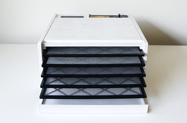 A white dehydrator with multiple layers