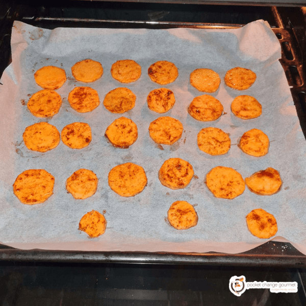 potatoes in white sheet tray toss in oven