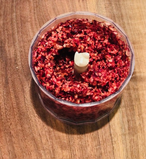 Finely chopped cranberries for cranberry apple relish.