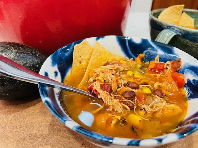 Bowl of Mexican Tortilla Soup with tortilla chips