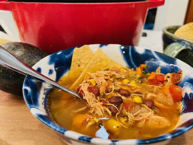 bowl of tortilla soup with chips