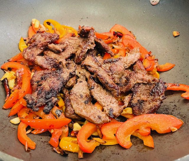 sliced fried beef and peppers