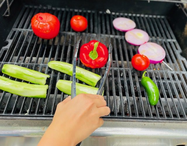 cucumbers, bell peppers, tomatoes, red onion on grill